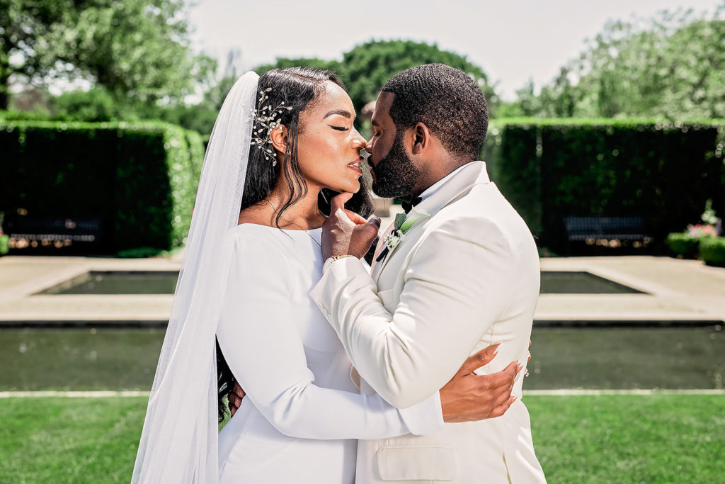 Wedding Day Bride and Groom Portraits Dallas Arboretum Black Couple Style All White Classy Upscale 
Wedding Photography Kiss