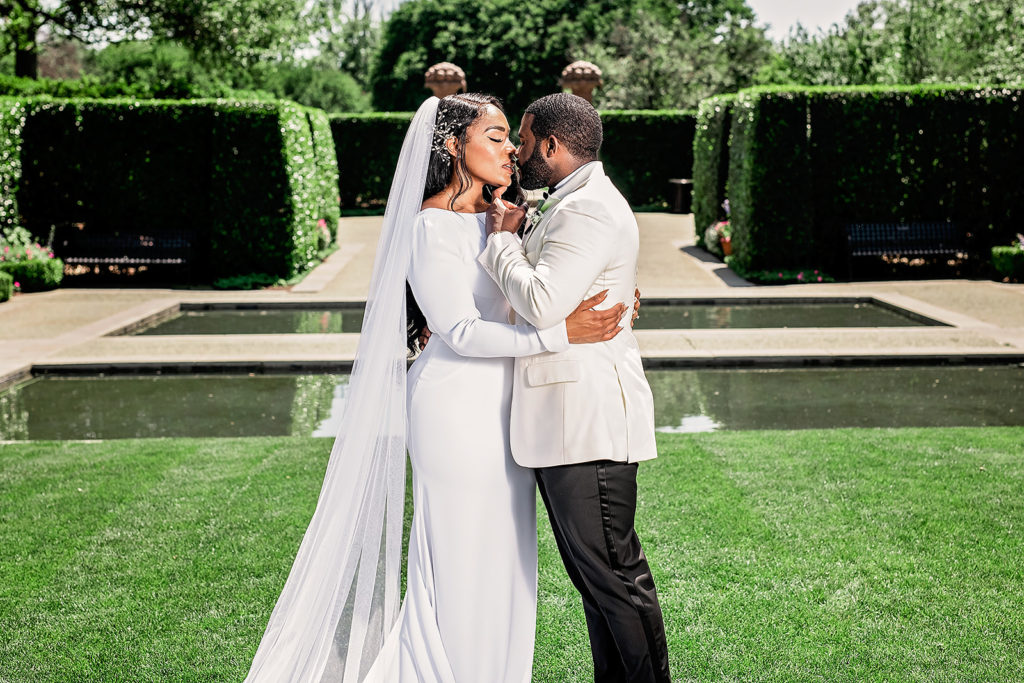 Wedding Day Bride and Groom Portraits Dallas Arboretum Black Couple Style All White Classy Upscale 
Wedding Photography Kiss