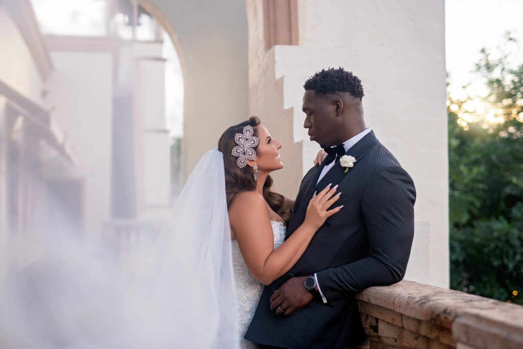 Interracial Bride and groom portraits the bell tower on 34th Houston Texas wedding veil glamorous 