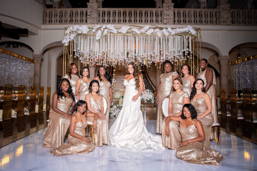 Bride and bridal party extravagant posing the bell tower on 34th houston texas wedding