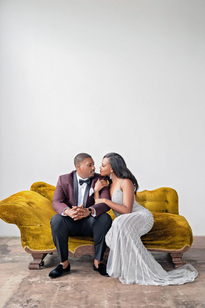 Formal engagement session outfits black couple style houston warehouse houston texas velvet couch prop