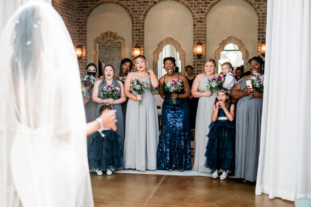 First look with Bridesmaids Iron Manor Houston Texas Wedding Getting ready multi colored bridesmaids
