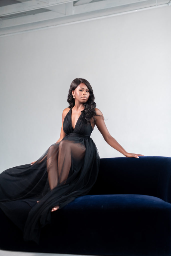 Lumen room Dallas Texas 30th Birthday Photoshoot outfit long black dress upscale classy velvet couch posing