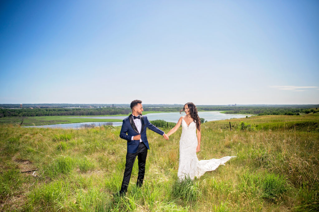 Outdoor bride and groom portraits 
 lush field landscape Minneapolis Minnesota 