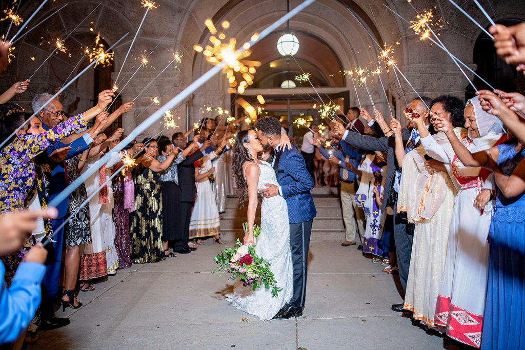 Landmark Center Wedding Reception St Paul Minnesota Sparkler Exit bride and groom kiss 