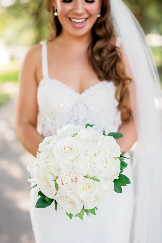 bride solo photo with bouquet wedding detail