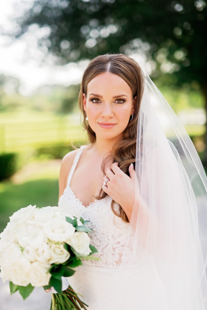 timeless wedding bride solo photo with veil and ring detail