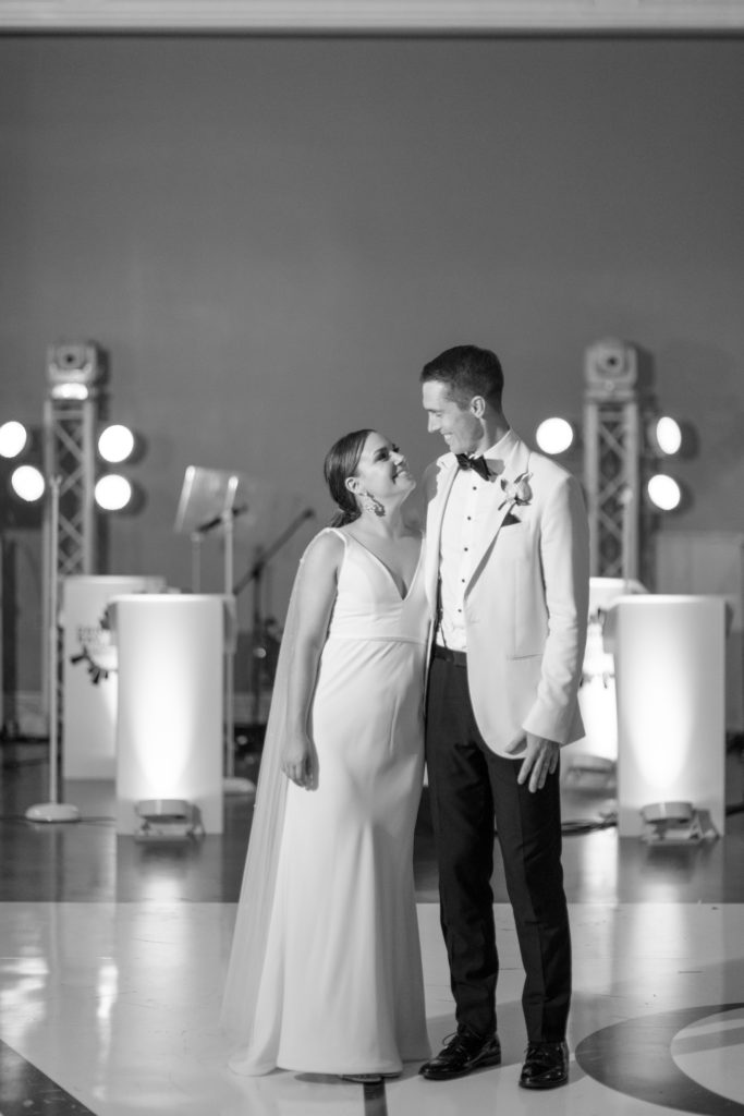 black and white first dance wedding pose