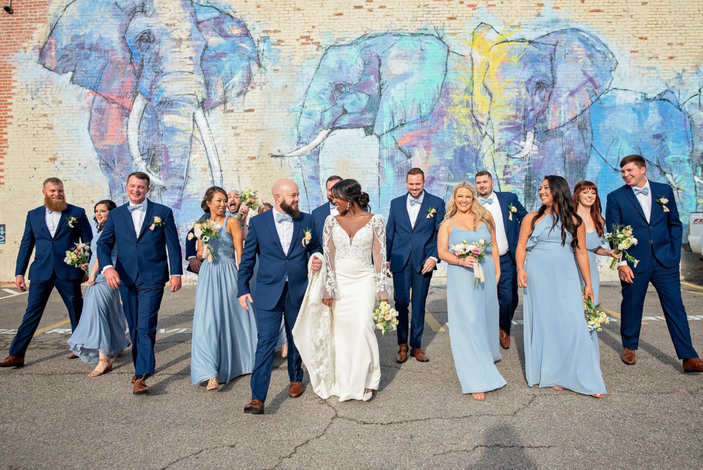 candid and silly wedding party photo bringing past and present together