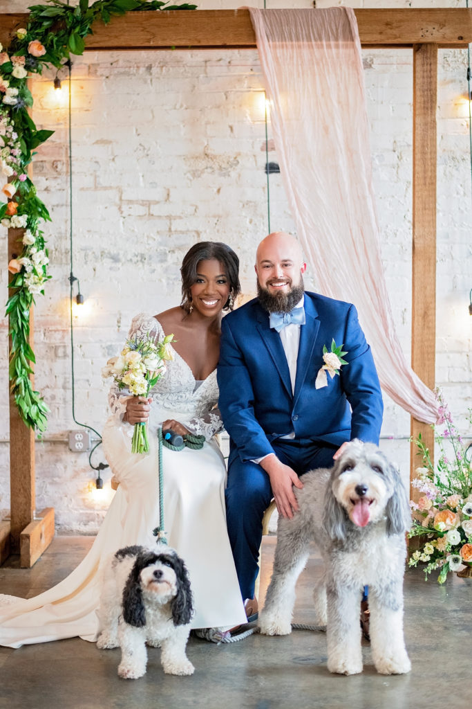 bride and groom wedding photo with dogs at brake and clutch warehouse Dallas, TX