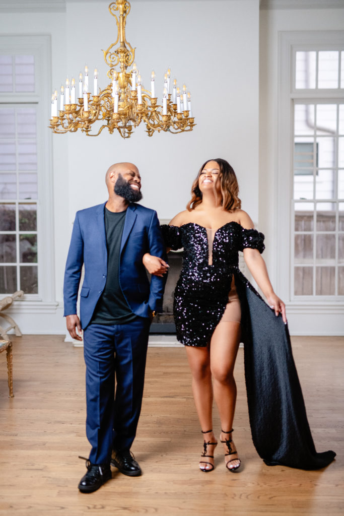 heads held high in fun and elegant photo session showcasing black dress cape at the Creative Chateau