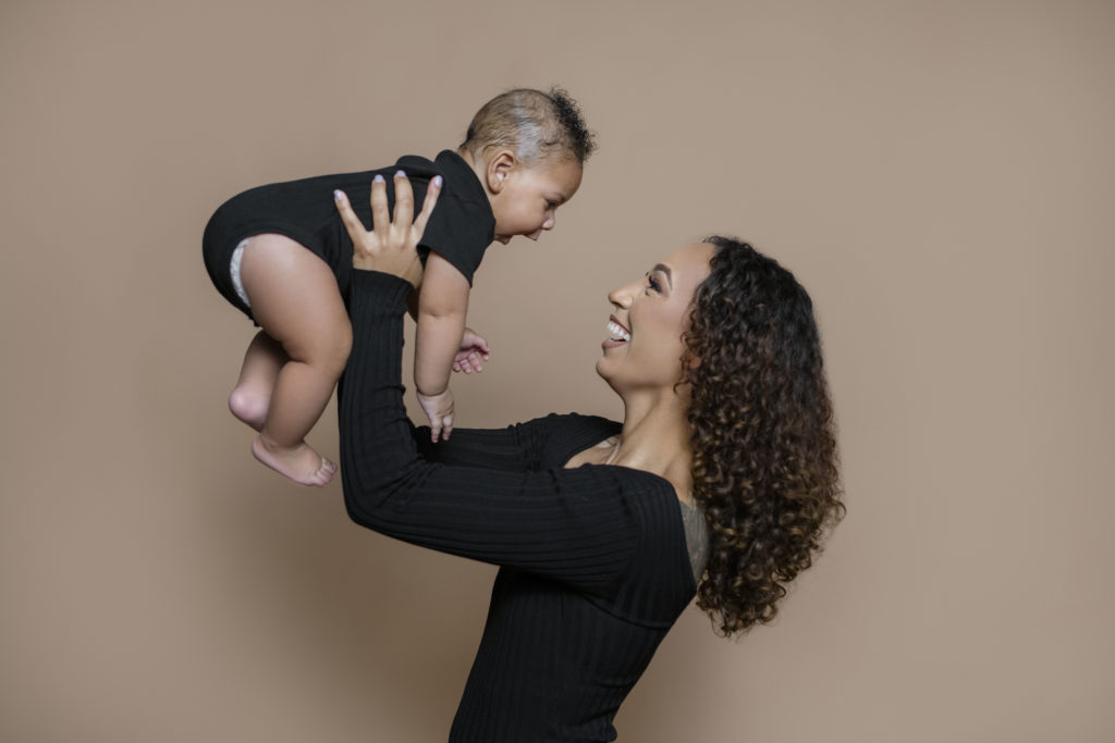 mom and toddler shot, brown backdrop, black photoshoot outfit, five month year old, 