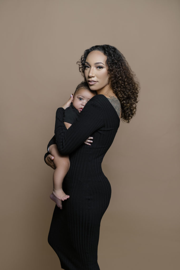 mom and toddler shot, brown backdrop, black photoshoot outfit, five month year old, 